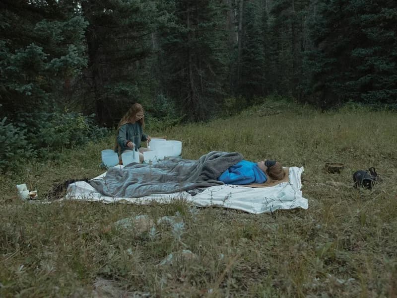 Sound healing session in a forest meadow